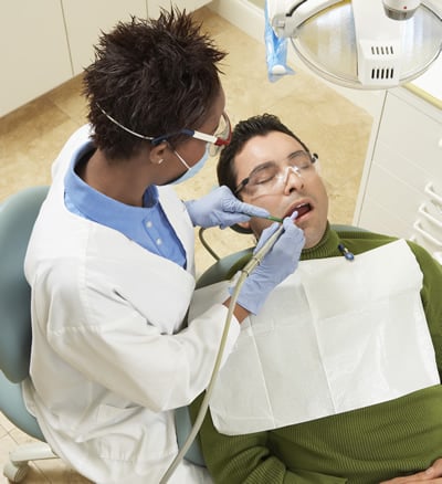 CrescentCare Dental technician working on patient